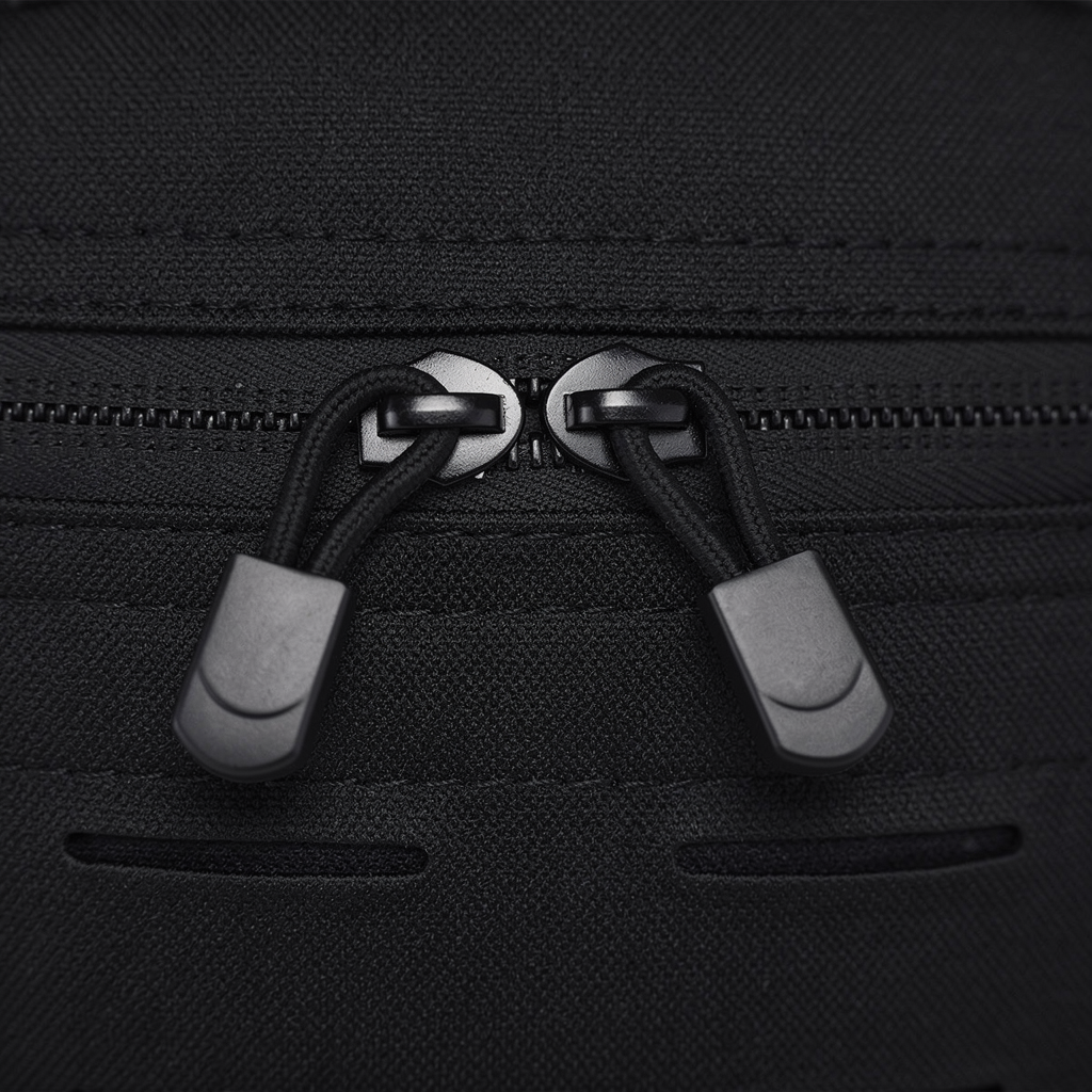 Close-up of the OmniFlint sling bag's dual water-resistant zipper detail